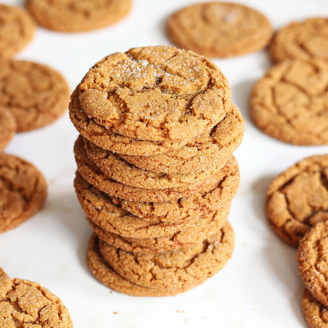 a playful stack of golden sugar-dusted cookies, not quite uniform in size on a baking tray